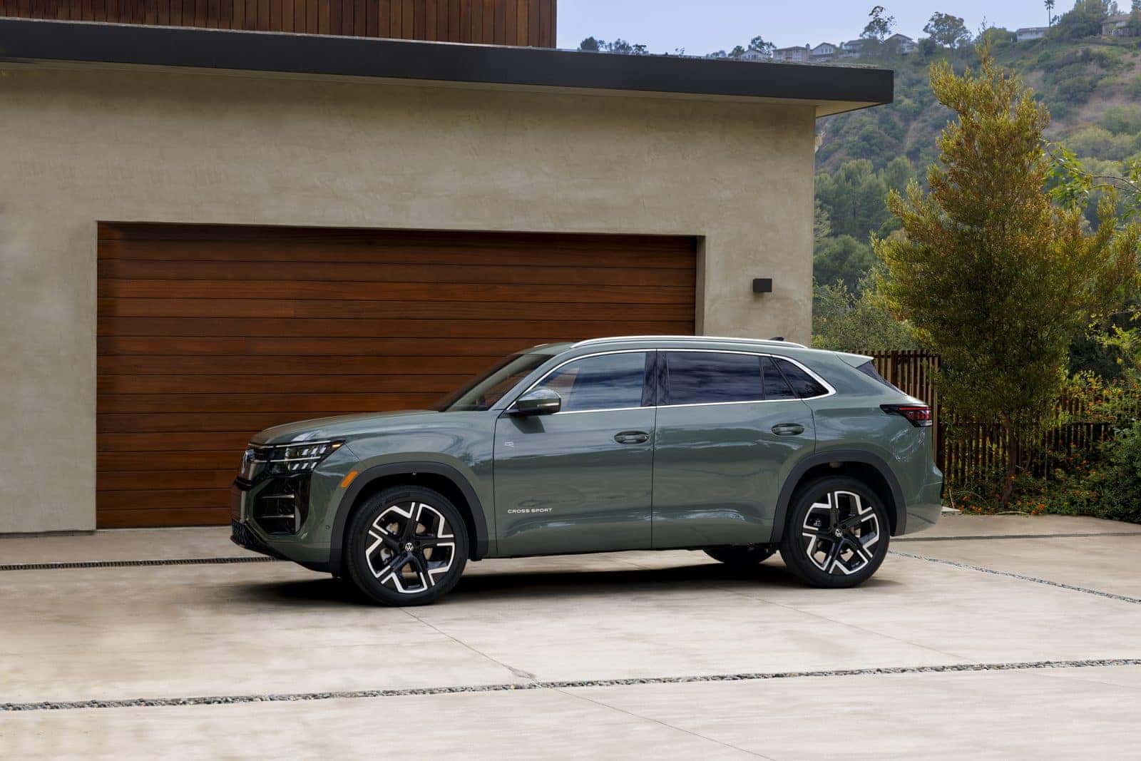 Side profile of the 2027 Volkswagen Atlas Cross Sport showing the coupe-like rear pillar and 195.6-inch overall length
