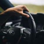 Up close of a hand on a 2022 INFINITI QX55 steering wheel