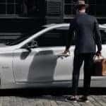 Man getting into INFINITI Q50
