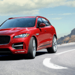 red Jaguar F-PACE on the road