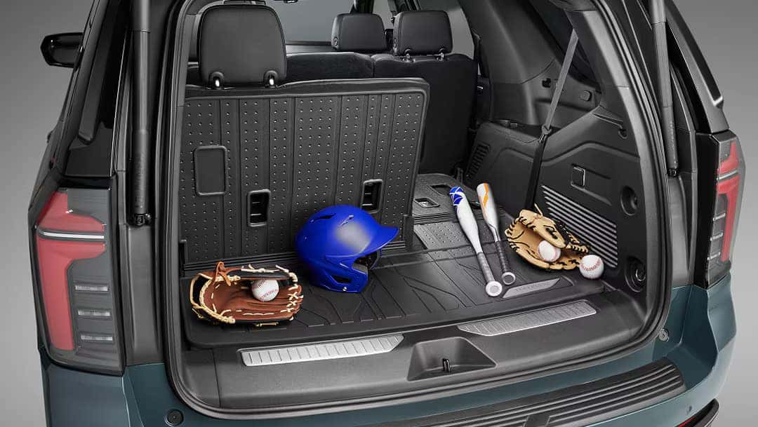 looking into a 2025 tahoe from the rear featuring cargo space with baseball equipment
