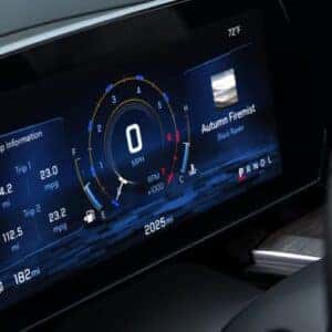 close up of digital gauge cluster showcasing speedometer