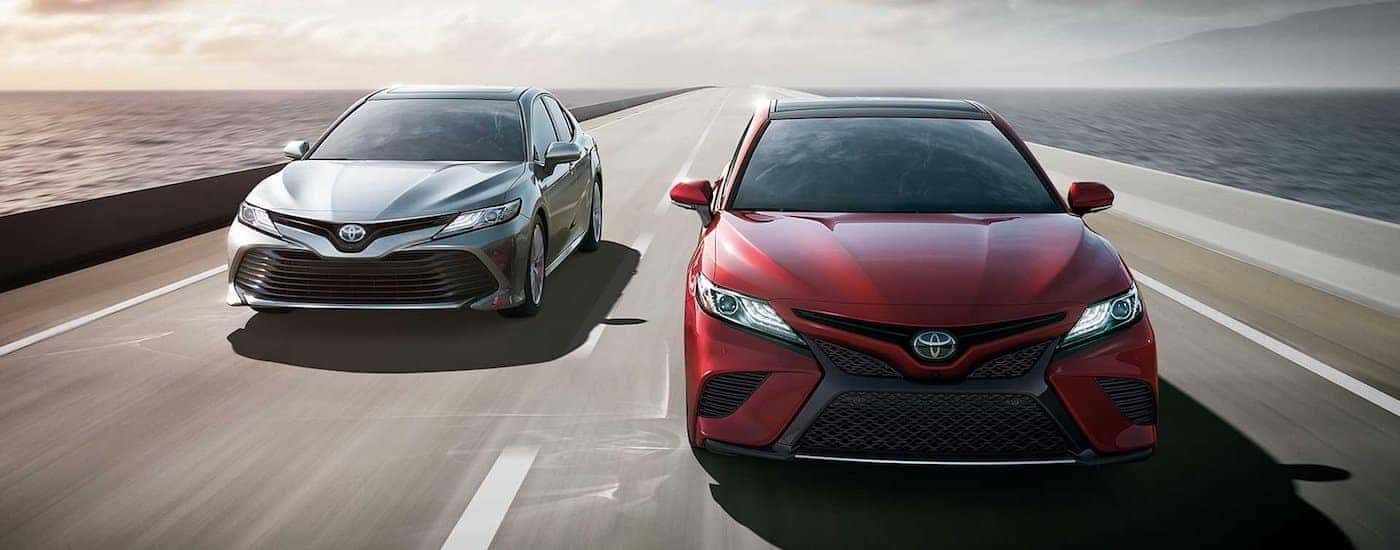 two 2018 Toyota Camrys red and silver