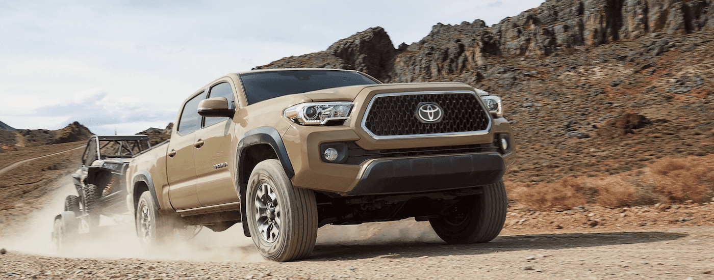 Tan 2018 Toyota Tacoma Off Roading