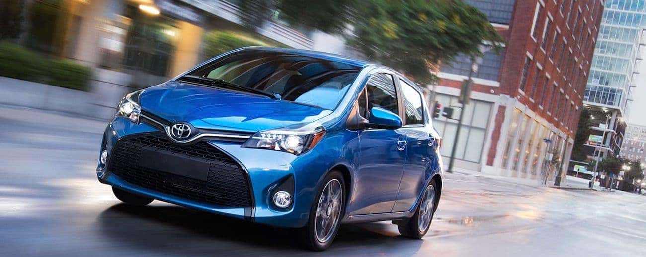 A bright blue 2019 Toyota Yaris on a Cincinnati street