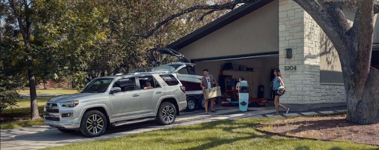 A silver 2019 Toyota 4Runner gets loaded up in the driveway of a suburban home
