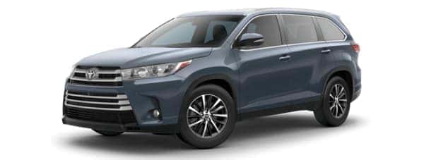 A gray/blue 2019 Toyota Highlander on white