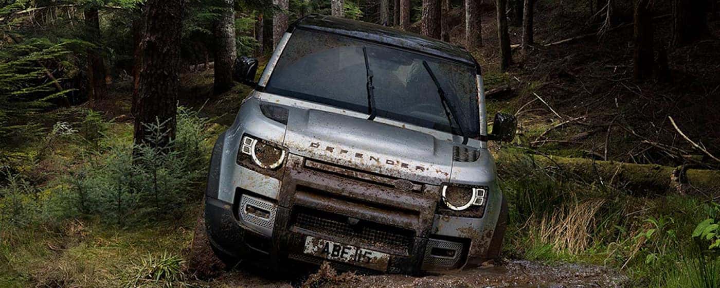 2020 land rover defender driving through mud