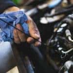mechanic checking oil levels