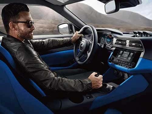 Man sitting inside the driver's seat of the 2023 Nissan Z