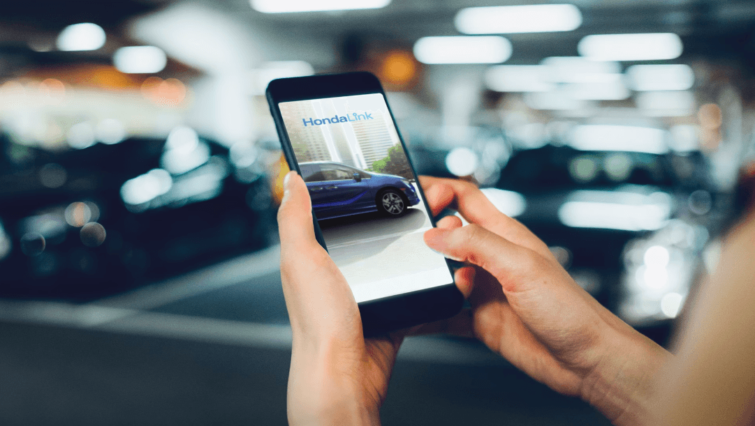 2023 Honda Passport Towing Person utilizing HondaLink® app on cellphone