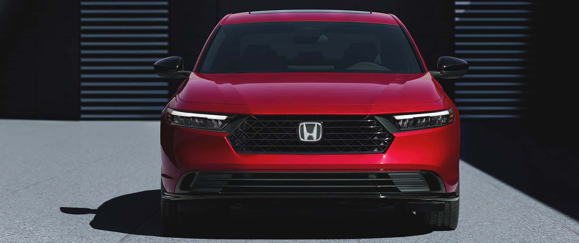A front view of a red Honda Accord.
