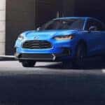 A blue 2026 Honda HR-V SUV turning onto a city street