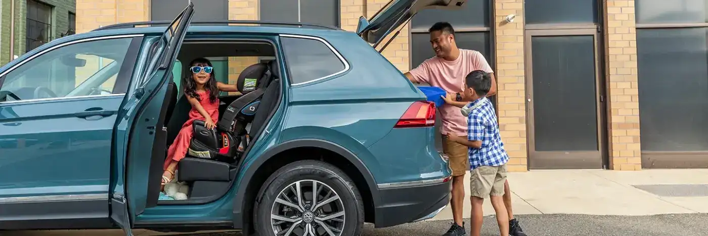 family outside SUV