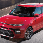 Red 2020 Kia Soul taking a turn
