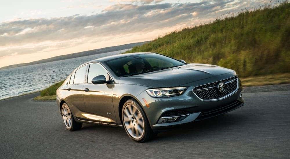 A gray 2019 Buick Regal on a test drive at dusk from a local Buick dealership