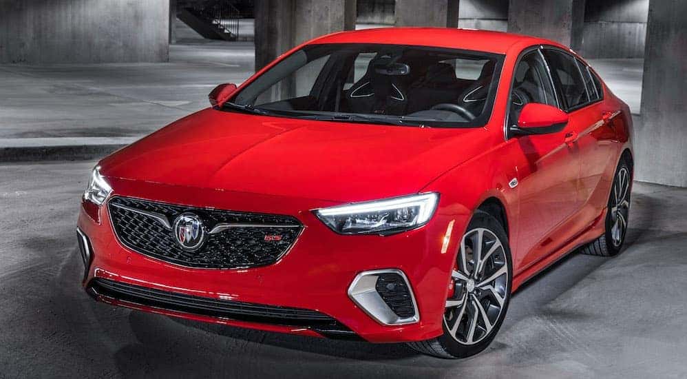 A red 2019 Buick Regal is shown parked in a parking garage.