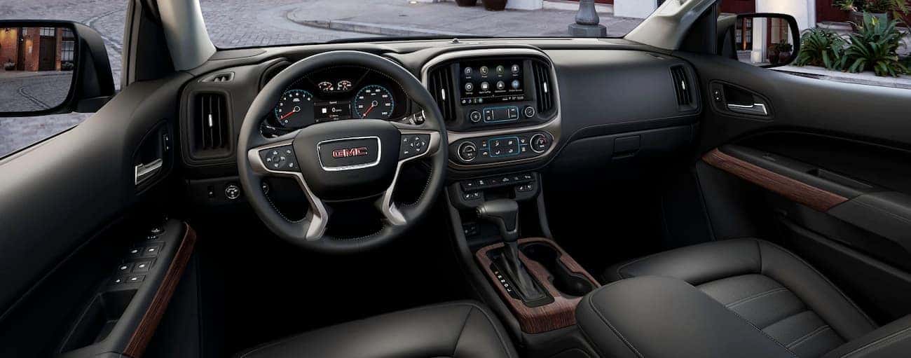 The black interior of a 2019 GMC Canyon is shown.