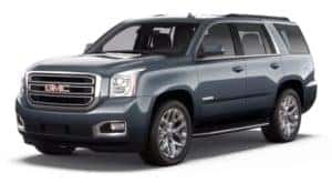 A grey 2020 GMC Yukon is facing left.