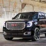 A black 2018 GMC Yukon is parked under a bridge near Atlanta, GA.