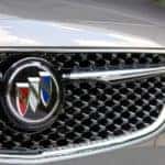 A close up of the front end of a 2020 Buick sedan.