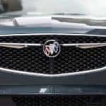 A close up a Buick SUV's front grille is shown.
