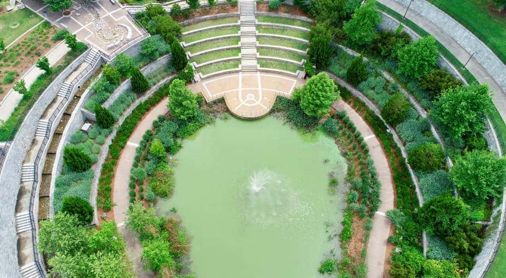 An aerial view of Historic Fourth Ward Park in Atlanta, GA, is shown.