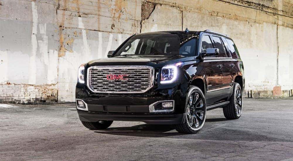 A black 2018 GMC Yukon is parked under a bridge in Atlanta, GA.