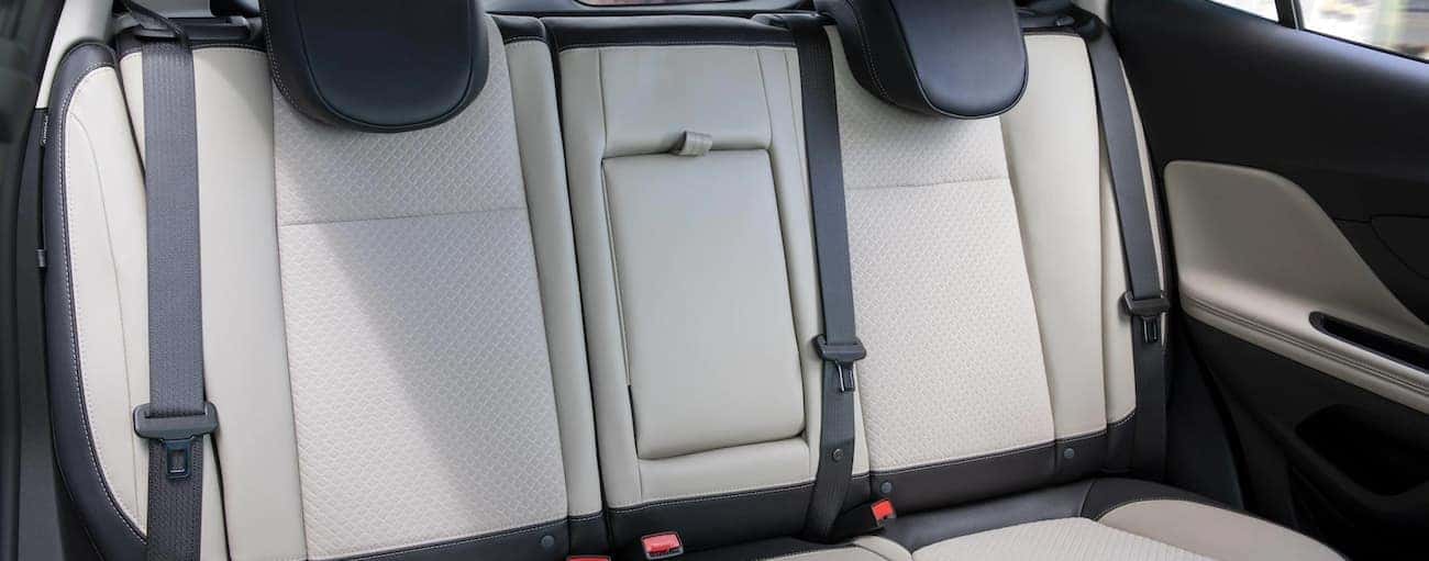 The white and black back seats of a 2021 Buick Encore are shown.