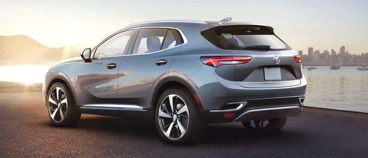 A silver 2021 Buick Envision is shown from the rear after winning the 2021 Buick Envision vs 2021 Acura RDX comparison.