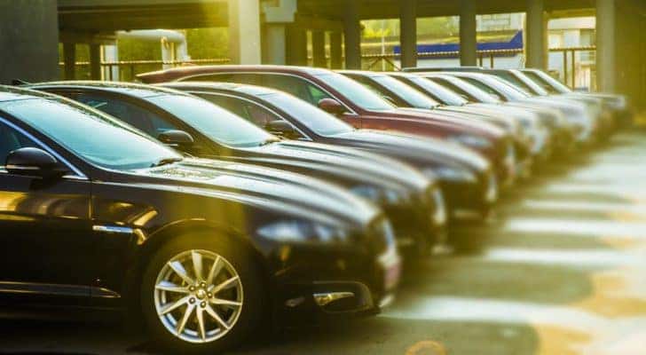 A row of cars are parked at an Atlanta pre-owned Chevy dealer.