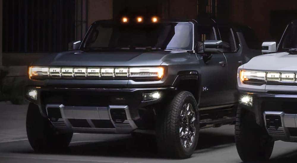 A grey 2022 Hummer EV is shown from the front.