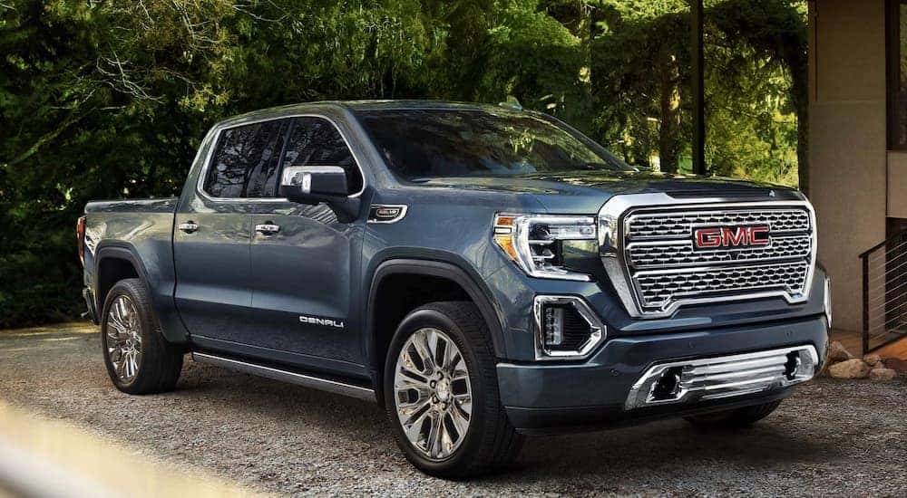 A 2021 GMC Sierra Denali is shown parked in a driveway after visiting a used GMC dealership in Atlanta.
