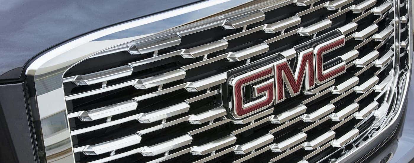 A close up shows the grille of a popular Certified Pre-Owned GMC, a grey 2020 GMC Yukon Denali.