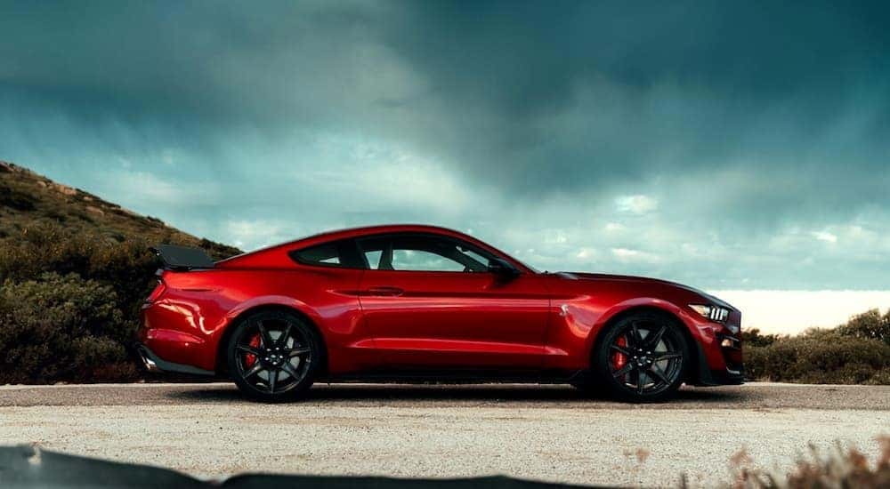 A red 2020 Ford Mustang Shelby GT-500 is shown from the side after deciding to search "sell my car".