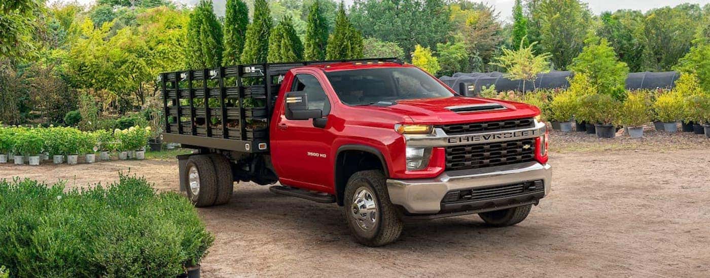 A red 2021 Chevy Silverado 3500HD is shown from the front at an angle.