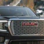 A black 2023 GMC Yukon Denali Ultimate is shown from the front after leaving a 2023 GMC Yukon Denali Ultimate dealer.