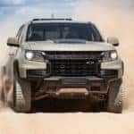 A tan 2021 Chevy Colorado ZR2 is shown off-roading.