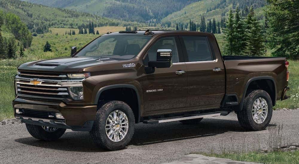 A popular used diesel truck for sale, a brown 2021 Chevy Silverado 2500, is shown from the side.