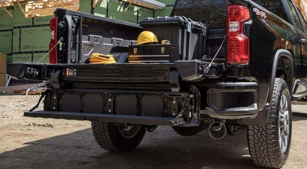 A black 2022 Chevy Silverado 2500 HD is shown from the rear.