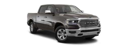 A grey 2023 Ram 1500 is angled right.