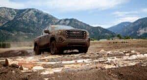 A muddy 2020 GMC Sierra 1500 AT4 is shown after looking at used trucks for sale.