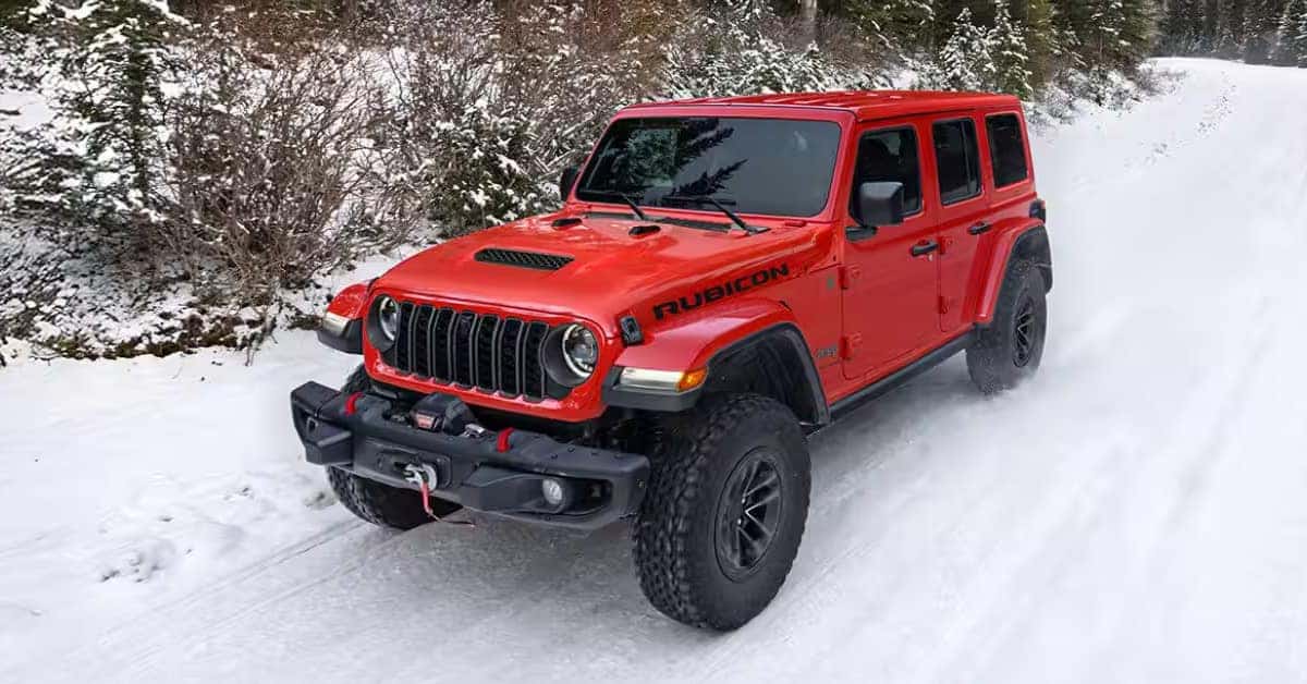 2026 Jeep Wrangler Rubicon driving on a snow-covered trail