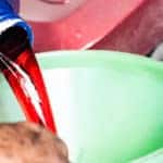 Pouring Transmission Fluid into Funnel