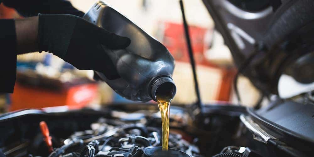 Oil Pouring Into Engine