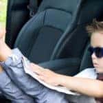 Young Boy Barefoot in Driver's Seat