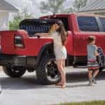 Family loading RAM 1500 Bed for Adventures.