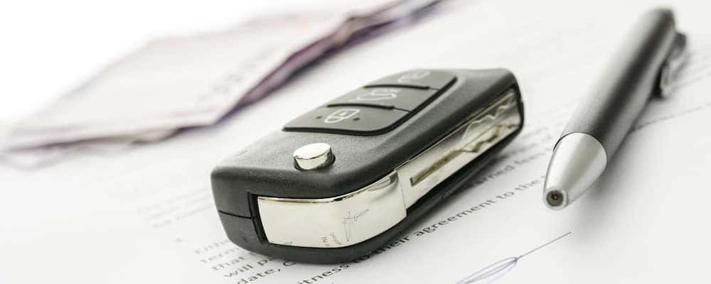 Car Key and Pen on Contract