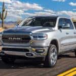 RAM 1500 towing a boat on road