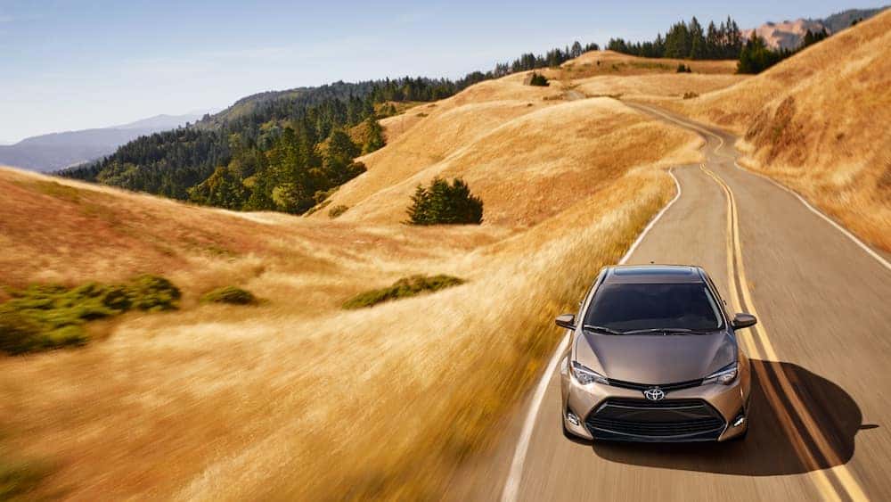 Silver 2019 Corolla driving down highway